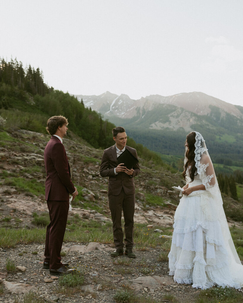 Bride and groom holding hands during their ceremony