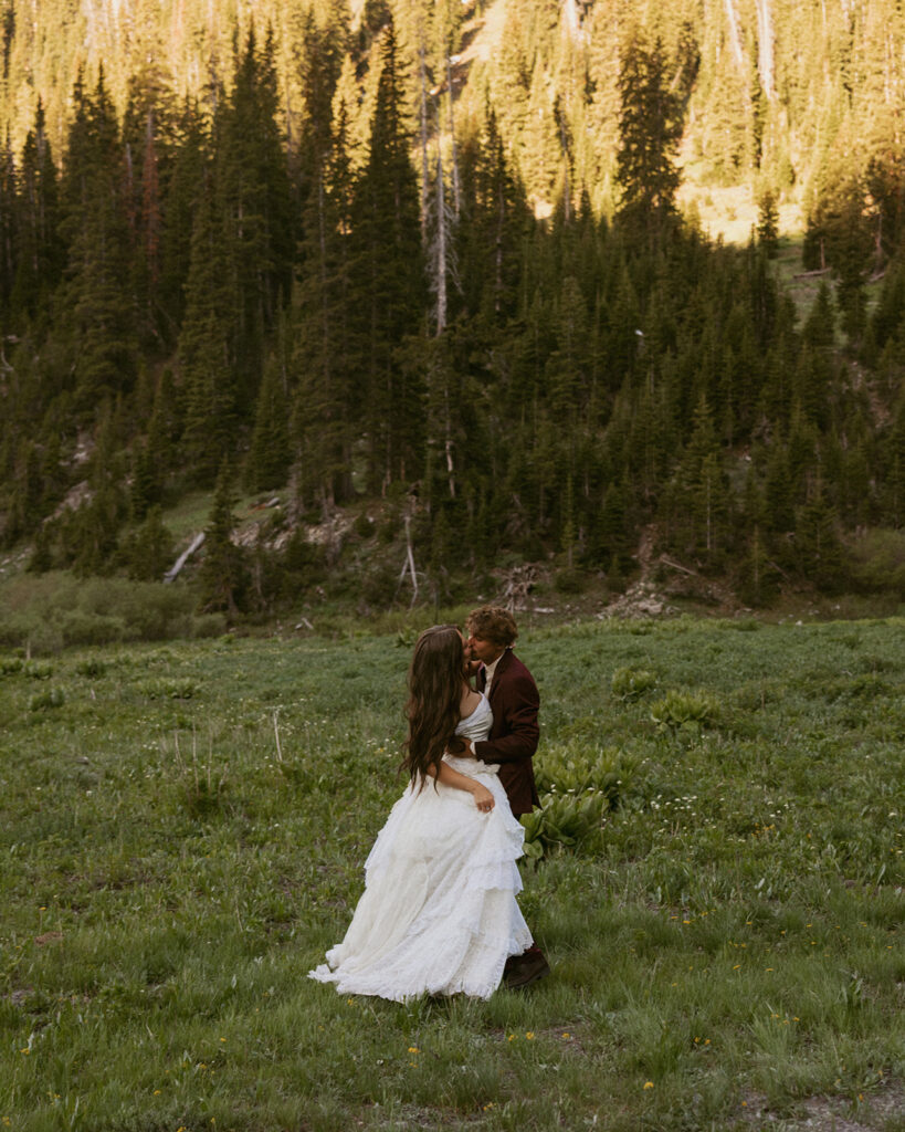 Groom, kissing the bride on the cheek