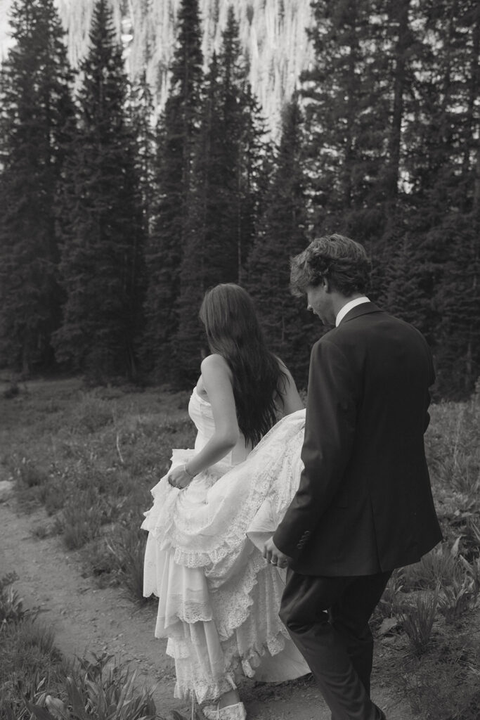 Couple walking around holding hands during their photo shoot