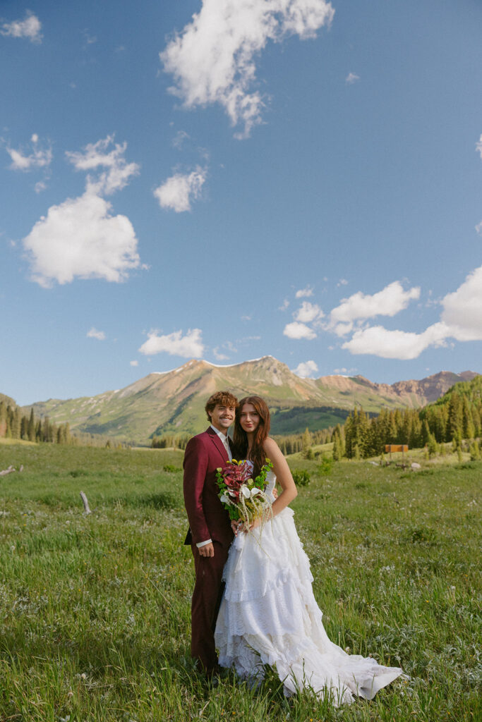 Couple smiling at the camera during their bridal session