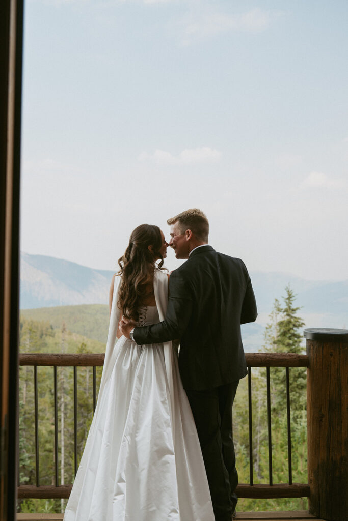 picture of the groom kissing the bride on the cheek