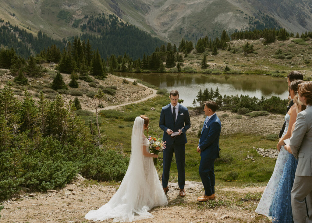 bride and groom holding hands during their wedding ceremony