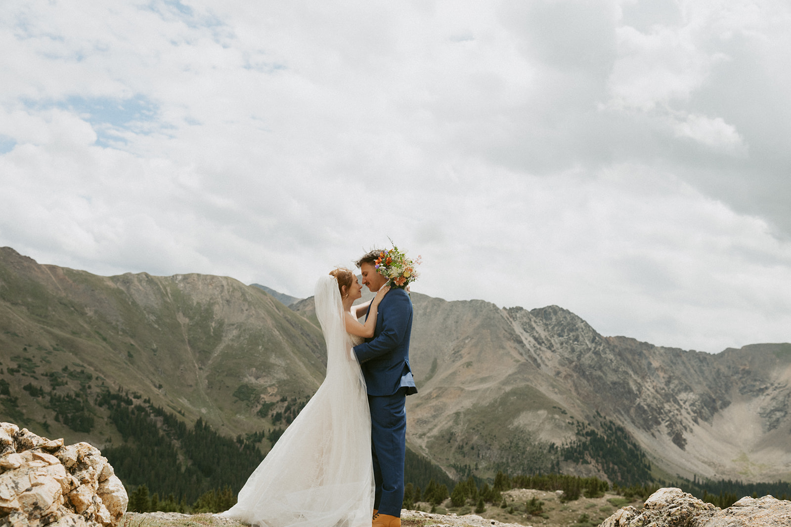beautiful portrait of the bride and groom smiling at each other