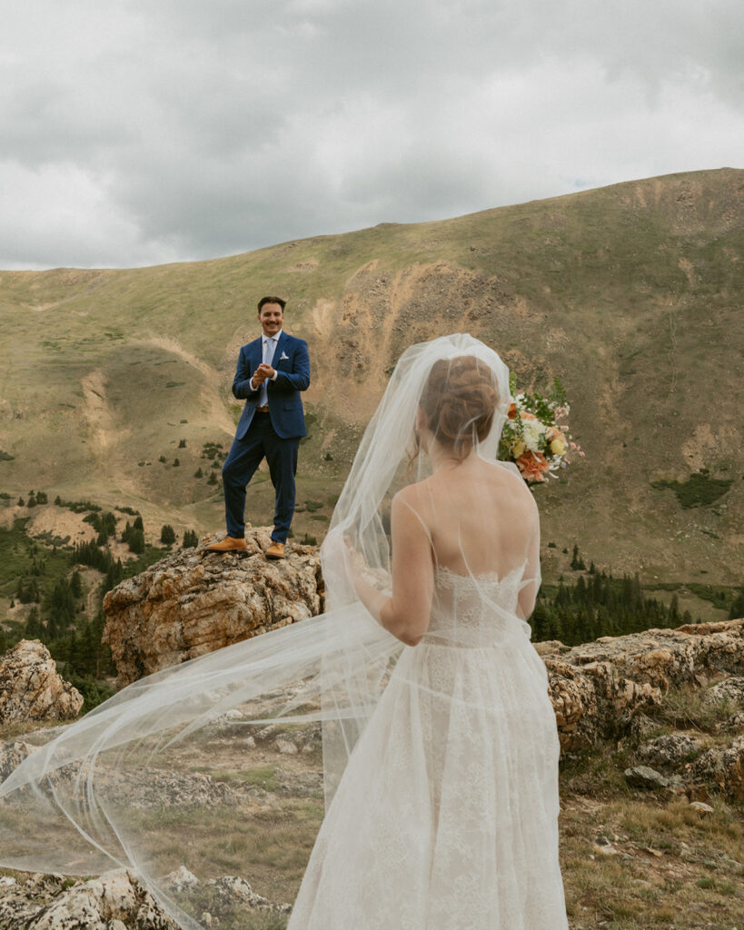 cute picture of the bride and groom laughing with each other during their bridal portraits in CO