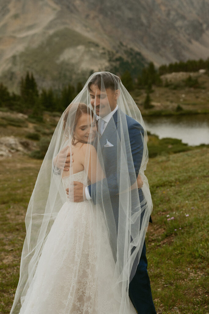 beautiful picture of the bride and groom hugging