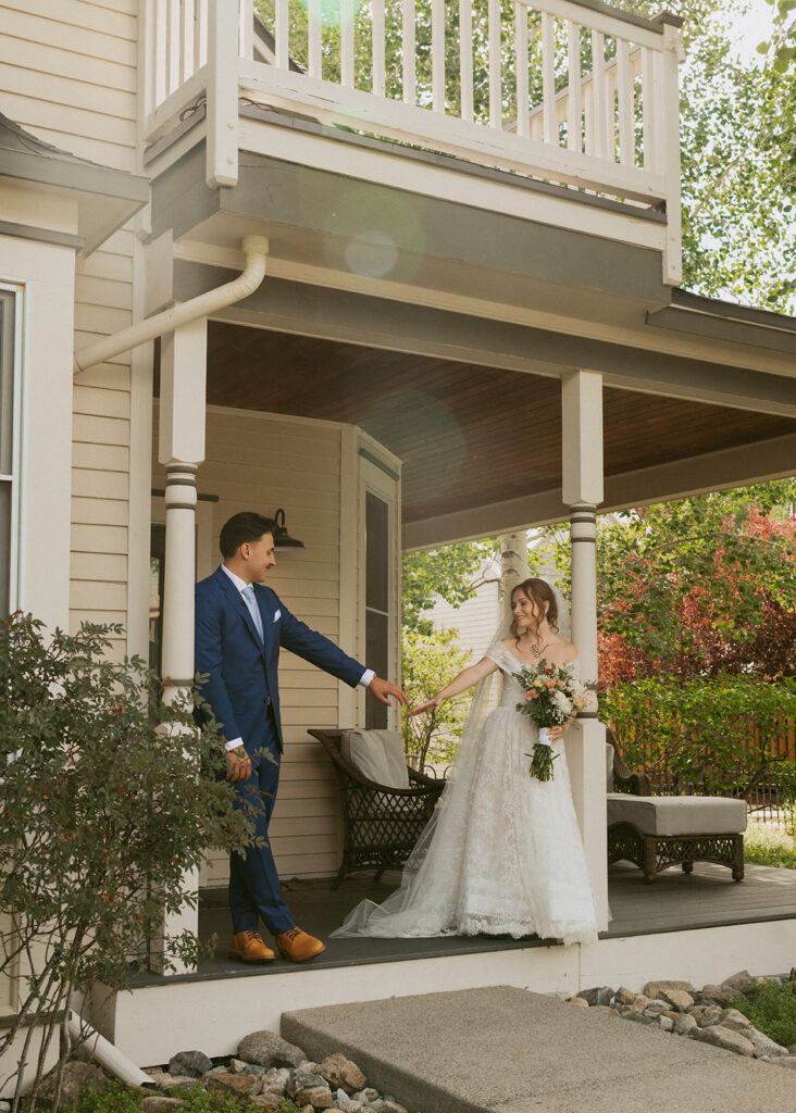 portrait of the bride and groom holding hands